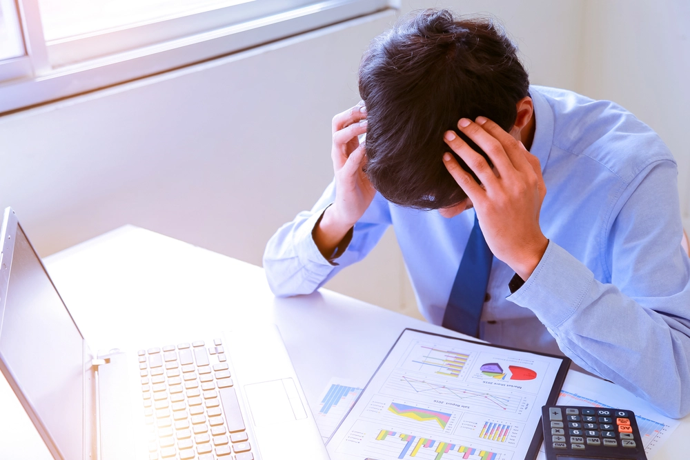 An employee stressed over data analytics