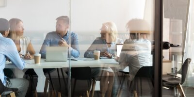 People negotiating in boardroom meeting