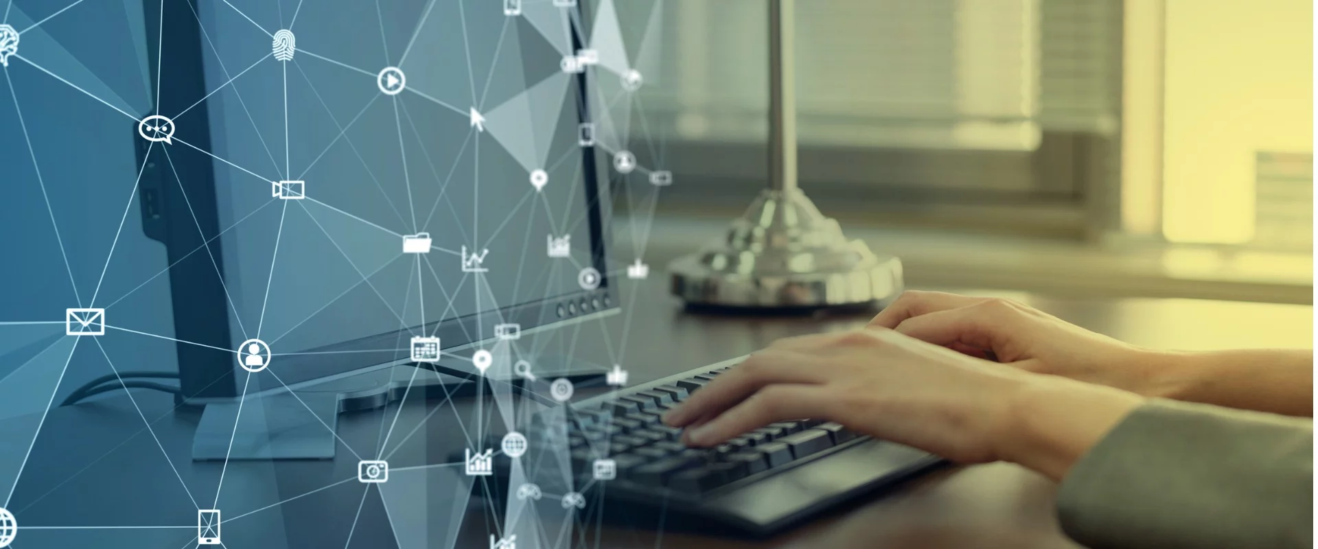 Closeup of hands on a keyboard in a modern office overlayed with icons connected by lines depicting the many uses for Robotic Process Automation.