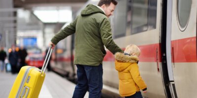 Little kid and thier father on railway