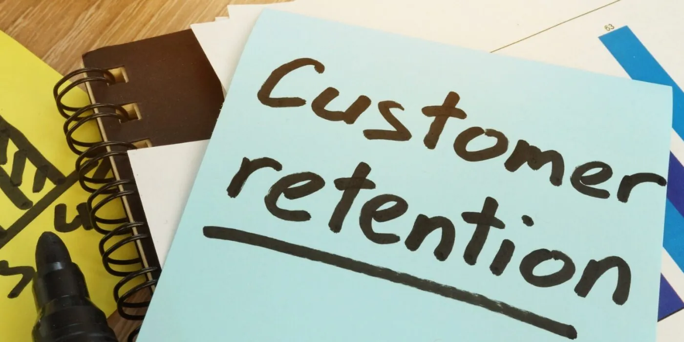 Customer Retention written on a sticky note