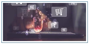 A finger touches a lit up cellphone screen. Above the screen float currency symbols and shopping cart icons.